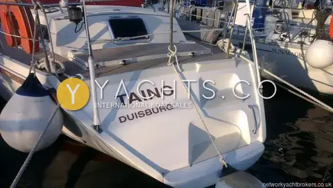 Amel Super Maramu 2000: transom with moulded boarding steps and the name Taino, Duisburg, fenders either side