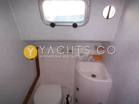 Aquastar Pacesetter 27 Boat For Sale: heads seen from above, showing hand basin, toilet and speckled wall lining