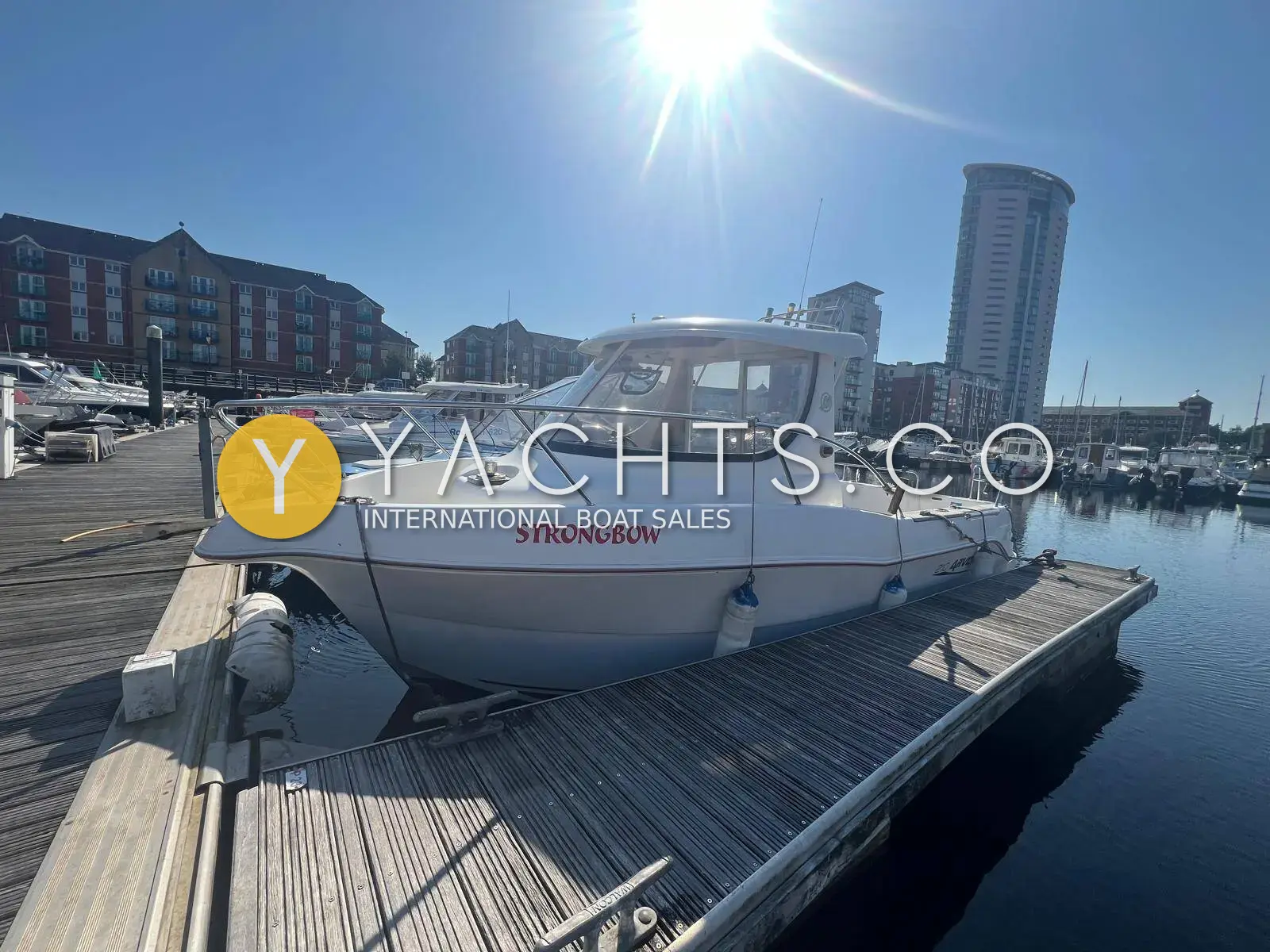 Arvor 210: white hull with red name on the topsides, moored at a pontoon in Swansea marina