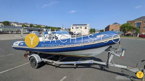 Avon 620 Adventure Rib: port side view of RIB on single axle trailer, blue tubes and white hull