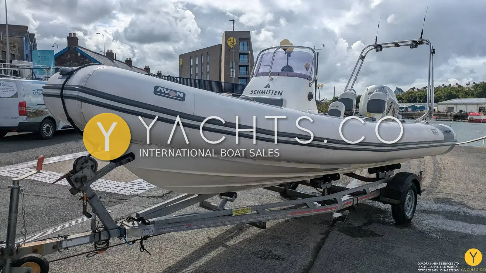 Avon Adventure 620 Rib & Trailer: white RIB with grey tube stripes sitting on her single-axle road trailer in a car park