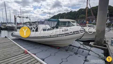 Avon Adventure 620 Rib & Trailer: rIB afloat on a grey modular floating dock at a marina pontoon