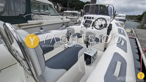 Avon Adventure 620 Rib & Trailer: cockpit with grey and white jockey seats facing the centre console and wheel
