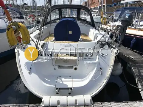 Bavaria 36: stern view showing open transom, bathing ladder, cockpit with covered wheel and sprayhood