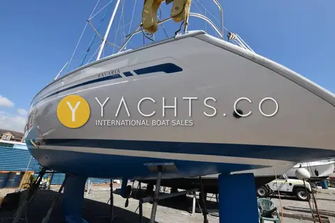 Bavaria 36 Holiday: bow view of hull ashore with stanchions, pulpit and furled headsail above