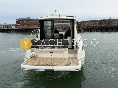 Bavaria S36: stern view showing teak bathing platform and open glass coupe doors