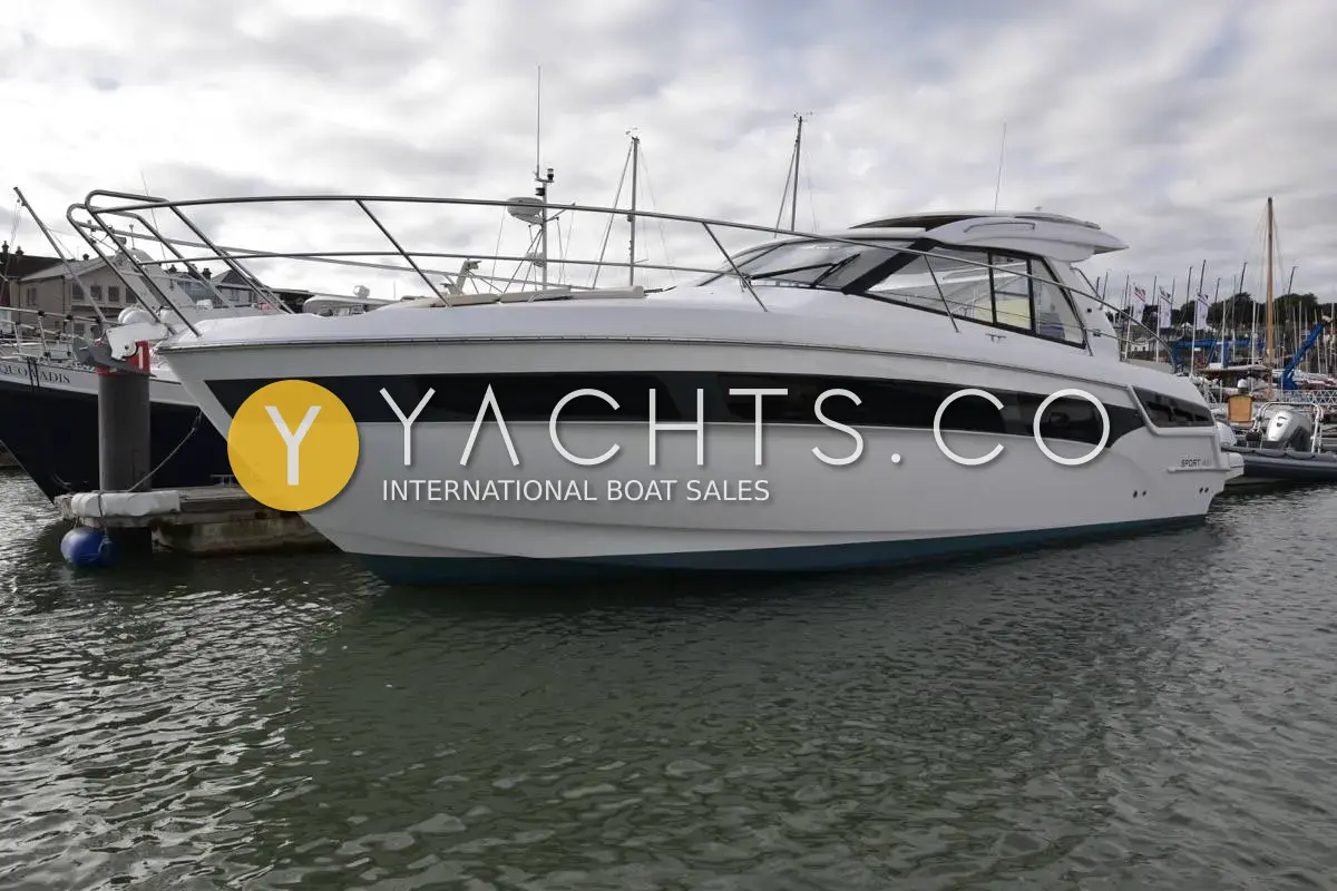 Bavaria Sport 400 HT: white hull with dark window band and hardtop, moored in a marina