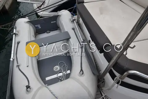 Bavaria SR41: inflatable tender with oars and bench seat stowed beside the aft sunbed