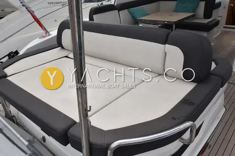 Bavaria SR41: aft sun lounge with white and charcoal cushions, some marks on the upholstery