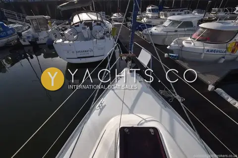 Bavaria Yachts Bavaria 30 Cruiser: bow looking forward over the anchor locker lid towards boats moored across the pontoon