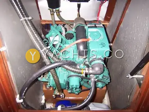 Bavaria Yachts Bavaria 34: engine bay with green diesel engine, exhaust and cooling hoses