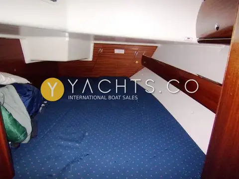 Bavaria Yachts Bavaria 36 Cruiser: aft cabin double berth in blue upholstery with bedding stowed to one side