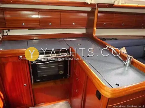 Bavaria Yachts Bavaria 36 Cruiser: l-shaped galley with gas oven, lidded worktops, sink and mahogany lockers