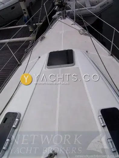 Bavaria Yachts Bavaria 40: foredeck looking forward over hatches to the bow, moored in a marina