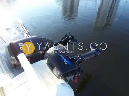 Beneteau Antares 5.80: stern view of the 90hp main outboard alongside a small Tohatsu auxiliary outboard on its bracket