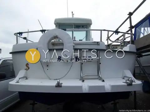 Beneteau Antares 620: transom with bathing platform, stainless boarding ladder and horseshoe lifebuoy