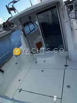 Beneteau Antares 7: cockpit looking forward to the open wheelhouse door, with flush deck hatches