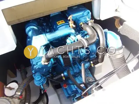 Beneteau Antares 7: engine bay showing the blue Nanni turbo diesel with black hoses