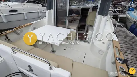 Beneteau Antares 7.80: cockpit table and side seating looking forward to the wheelhouse doors