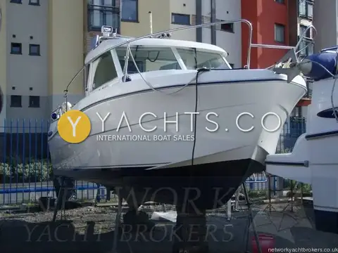 Beneteau Antares 710: hull ashore on stands, bow view with stainless radar arch and rails