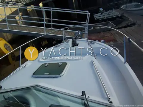 Beneteau Antares 760: foredeck from the wheelhouse roof showing coachroof hatch, grab rails and bow pulpit
