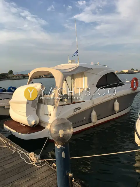 Beneteau Antares 8 Classic: starboard quarter view at pontoon under evening sky, folded cockpit canopy