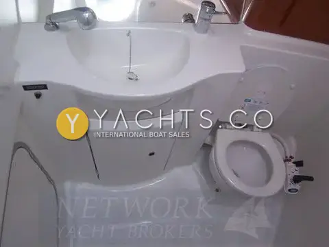 Beneteau Antares 9.80: heads compartment with moulded wash basin, pull-out shower tap and marine toilet