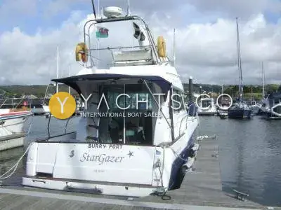 Beneteau Antares 980: stern view showing transom name, swim platform and rear cockpit enclosure on a pontoon