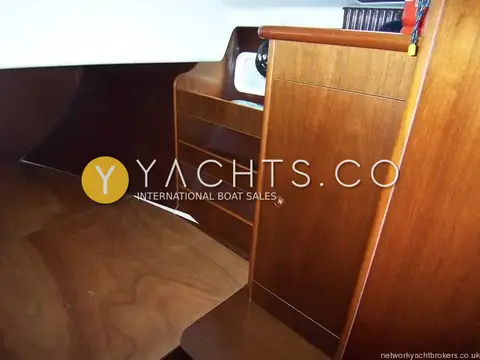 Beneteau Oceanis 411 Clipper: forward cabin with wooden berth base, shelving and storage locker