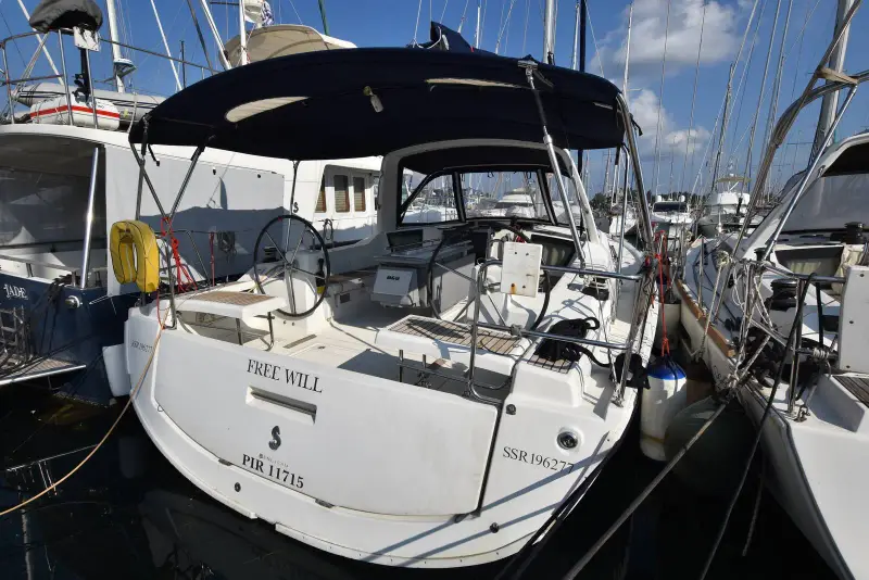 Beneteau Oceanis 42.1: stern view in a marina berth with transom name and open bathing platform