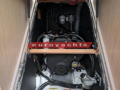 Beneteau Oceanis 45: engine bay opened under the companionway steps showing the diesel engine