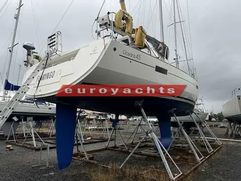 Beneteau Oceanis 45: stern quarter view of the hull standing ashore on cradle supports