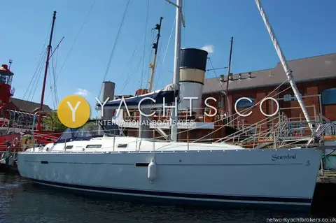 Beneteau Oceanis Clipper 343: starboard side moored alongside, white hull with navy boot stripe and name Seawind