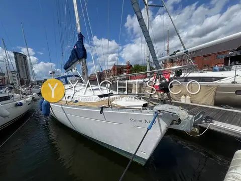 Beneteau Oceanis Clipper 381: bow quarter view of white hull moored stern-to in a marina basin