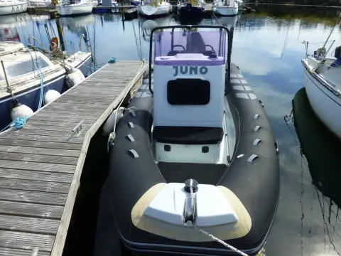 Brig RIBs Navigator 610: bow view from the pontoon showing square bow, cushion over the anchor locker and console