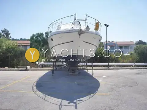 Cranchi 37 Smeraldo: bow view ashore on stands showing pulpit rail and anchor fitting