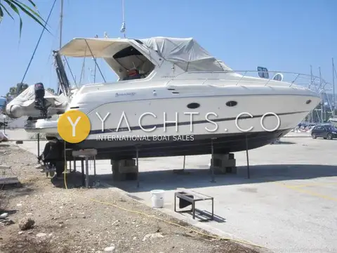 Cranchi 37 Smeraldo: starboard profile ashore with bimini and covers fitted, outboard on the transom