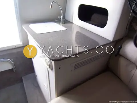 Crownline 230 CCR: cabin galley unit with speckled worktop, inset white sink and tap