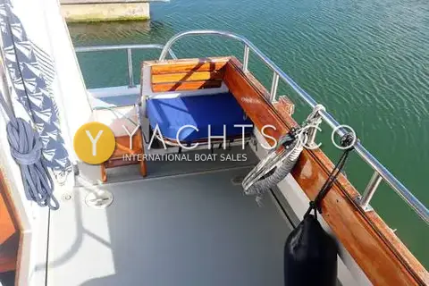 Cygnus Marine Cygnus Cyclone 26 Patrol Mk III: aft cockpit corner with blue cushioned fold-down seat and varnished timber capping
