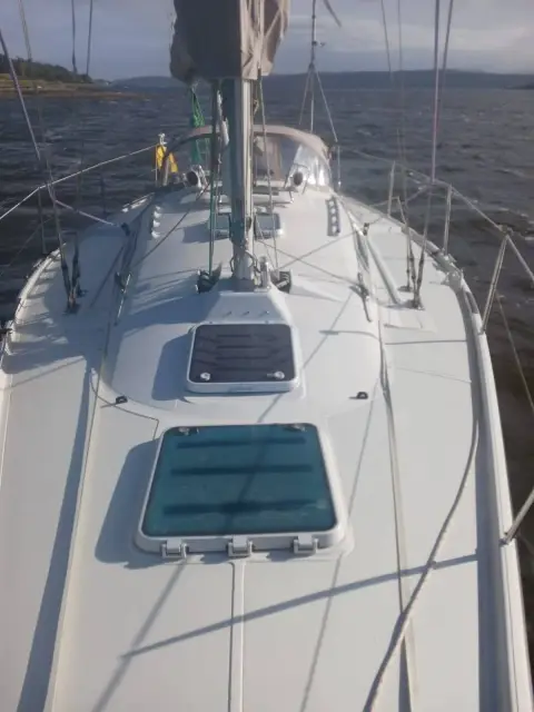 Dehler 38 CWS: foredeck looking forward with two flush hatches and white non-slip deck