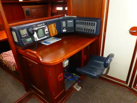 Dehler 43 CWS: chart table with mounted electronics, switch panel and folding blue seat