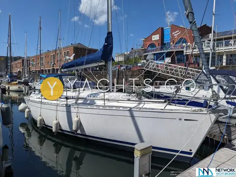 Dufour 36 Classic Owners Version: starboard bow view moored in marina with fenders out and blue stack pack