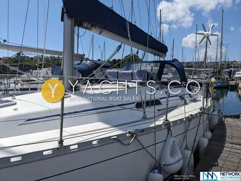 Dufour 36 Classic Owners Version: side deck and coachroof looking aft towards sprayhood and wind generator