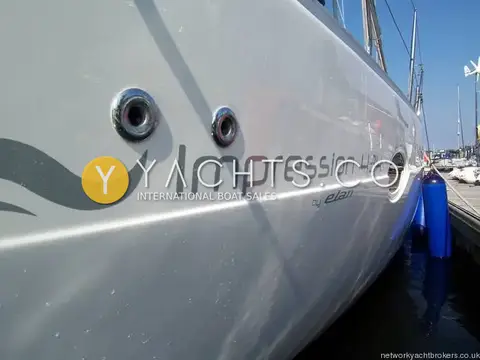 Elan Marine Elan Impression 434: close view of grey hull side graphics and two stainless steel hull fittings