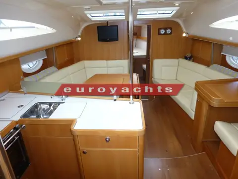 Elan Marine Impression 434: saloon and galley with double sinks, U-shaped settee and bench settee opposite