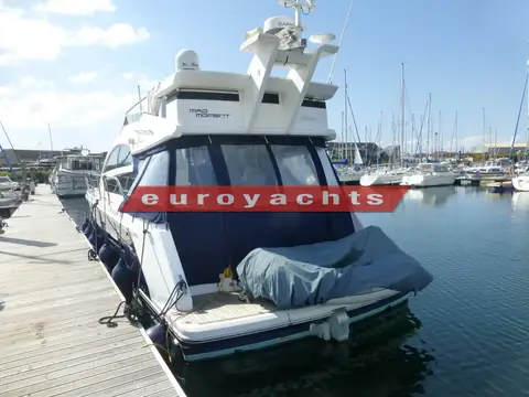 Fairline Squadron 42: stern view showing cockpit canopy, covered tender on aft platform and flybridge radar arch