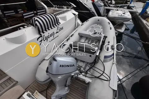 Fairline Squadron 62/65: tender with Honda outboard stowed on the extended bathing platform beside the transom
