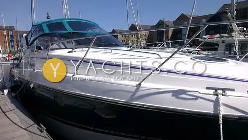 Fairline Targa 38: port side at a Swansea marina pontoon, white topsides over dark green hull with green canopy