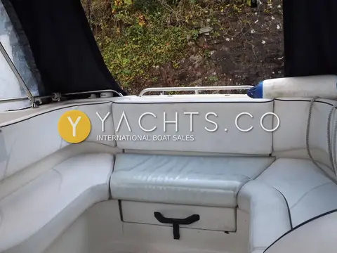 Fletcher 19GTS Sportcruiser: rear cockpit with grey wraparound bench seating and stern rail, enclosure open