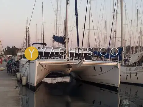 Fountaine Pajot Orana 44: bows-on view moored stern-to in a marina at dusk among other masts